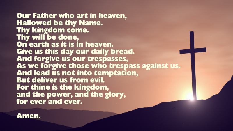 The Lord's Prayer with image of a cross on a hill side